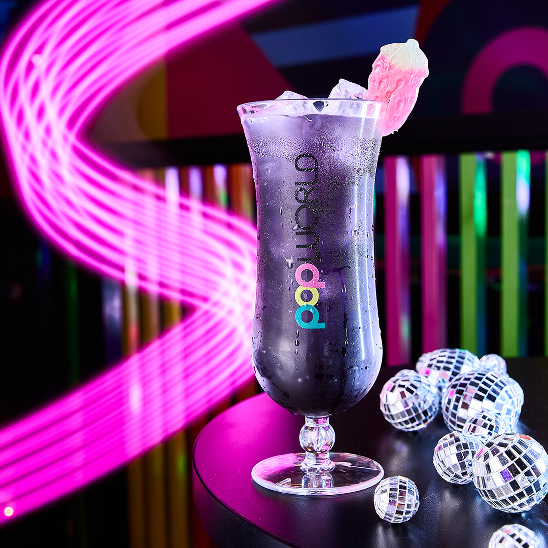 Purple Popworld cocktail with discoballs