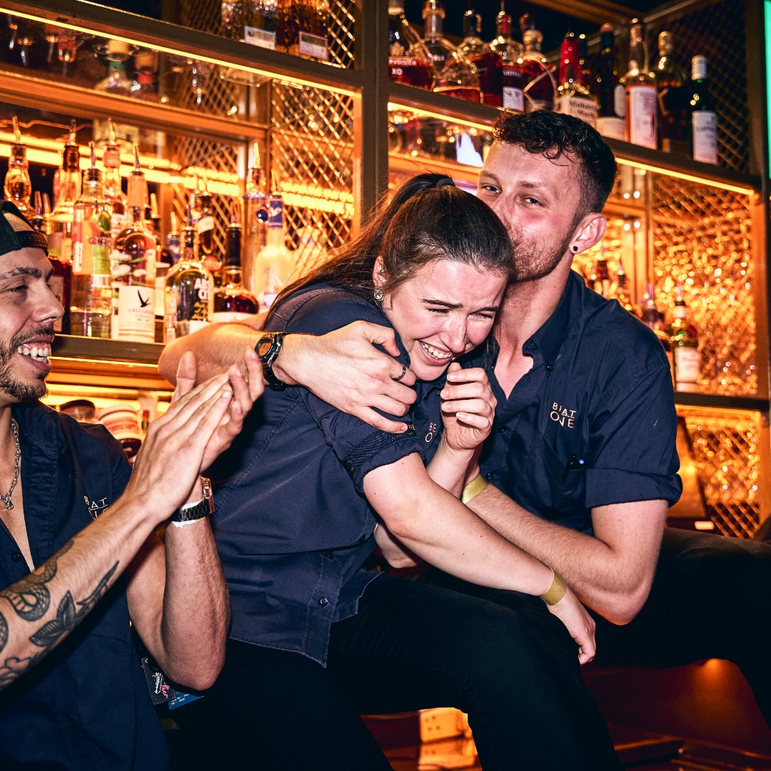 Two Be At One bartenders congratulating each other