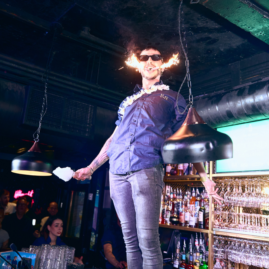 Be At One bartender stood on the bar