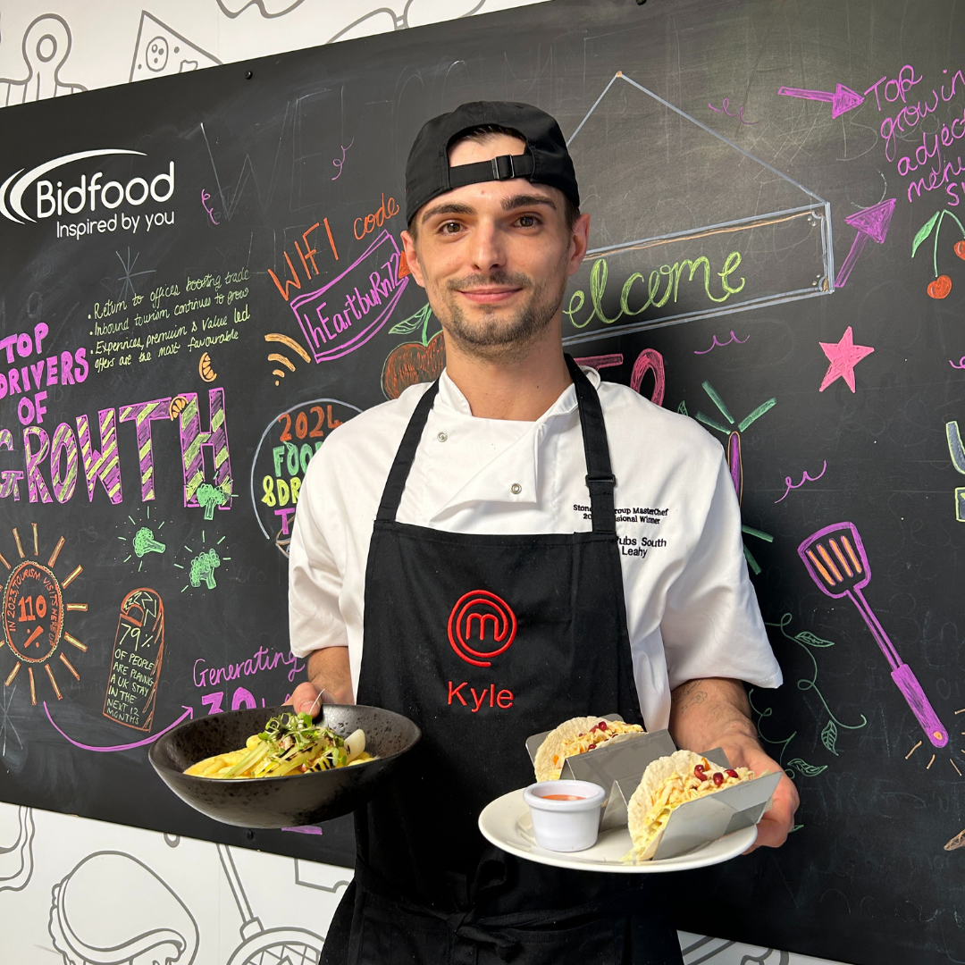 Masterchef finalist, Kyle holding his two final dishes