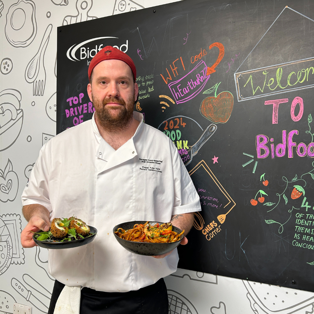 Masterchef finalist, Richard holding his two final dishes
