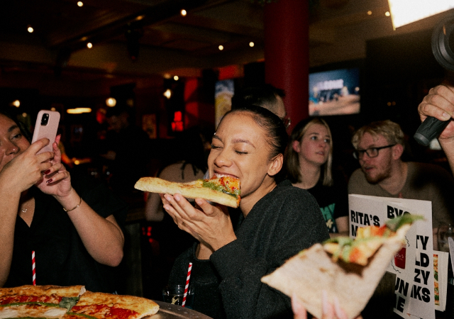 Biting Rita's XL Pizza Slice