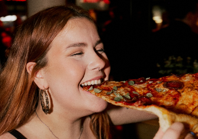 Biting Rita's XL Pizza Slice