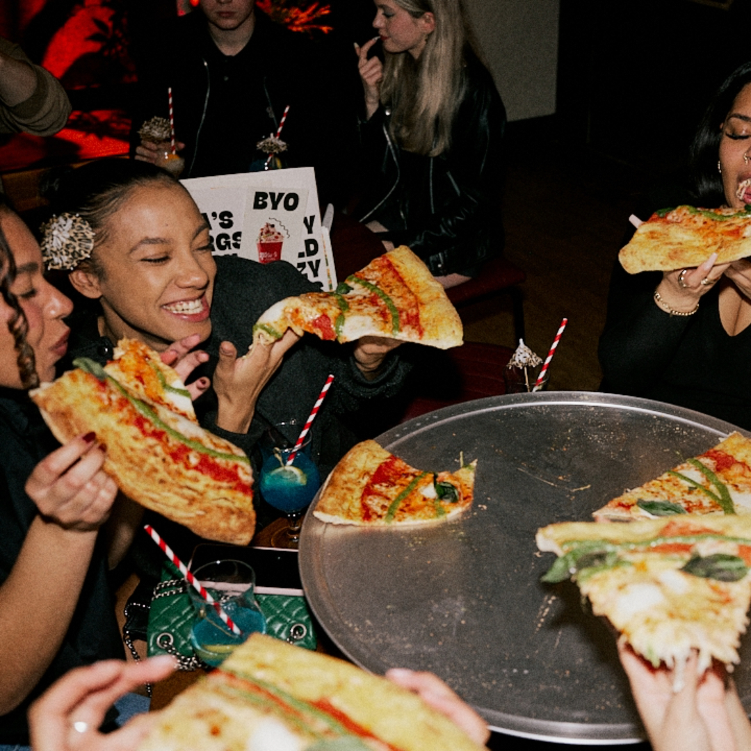 People enjoying slices at Rita's