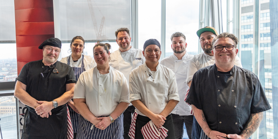 Eight Stonegate Kitchen Team members smiling to the camera