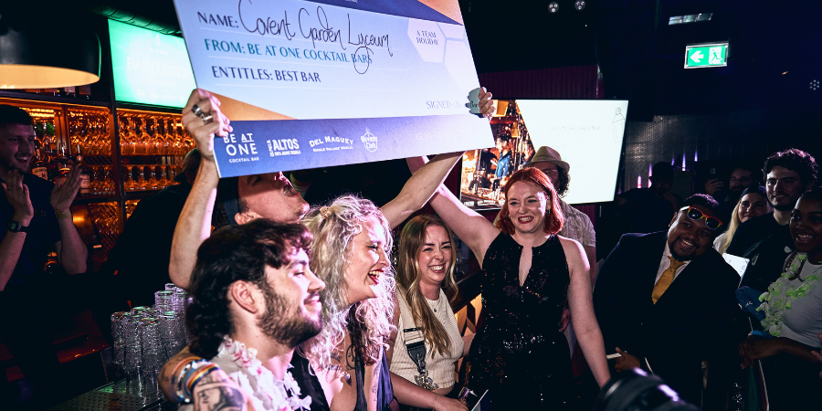 Be At One Covent Garden team members posing for a photo with their cheque