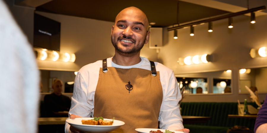 Waiter holding plates