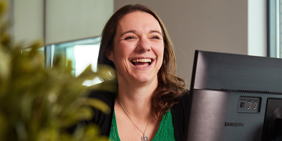 Pub Support Team member laughing at camera